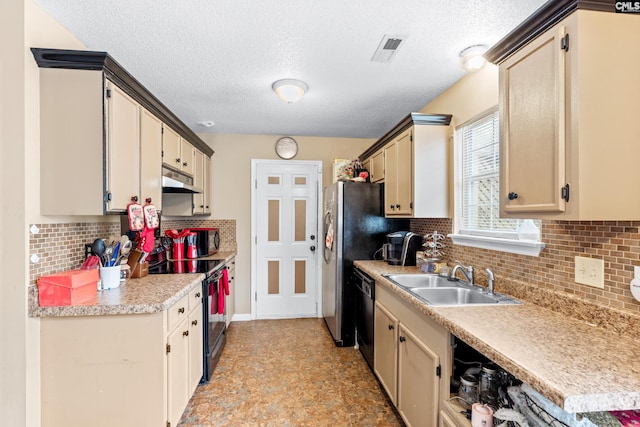 kitchen featuring black appliances, decorative backsplash, sink, and cream cabinetry