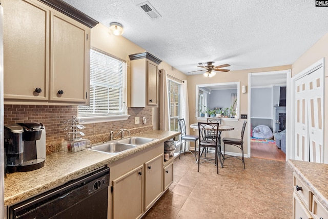 kitchen with dishwasher, sink, ceiling fan, a textured ceiling, and tasteful backsplash