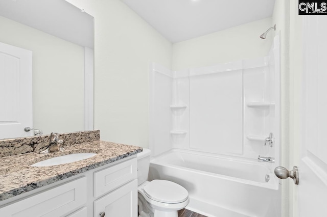 full bathroom featuring vanity, hardwood / wood-style flooring, toilet, and tub / shower combination