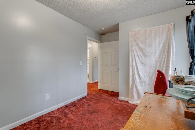 carpeted bedroom featuring a textured ceiling