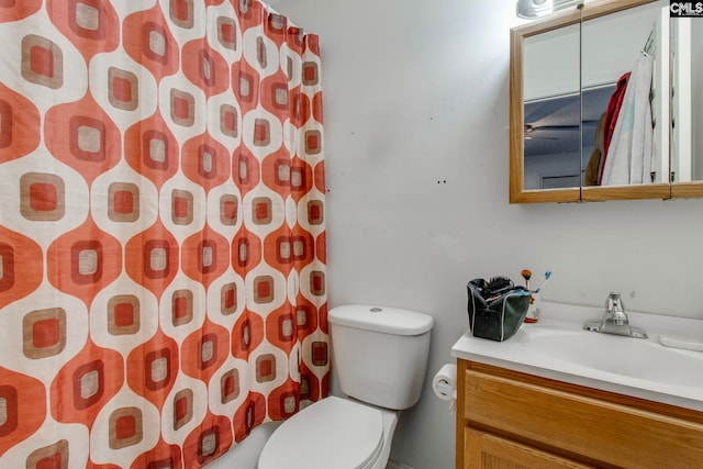 full bathroom with vanity, toilet, and shower / bath combo with shower curtain