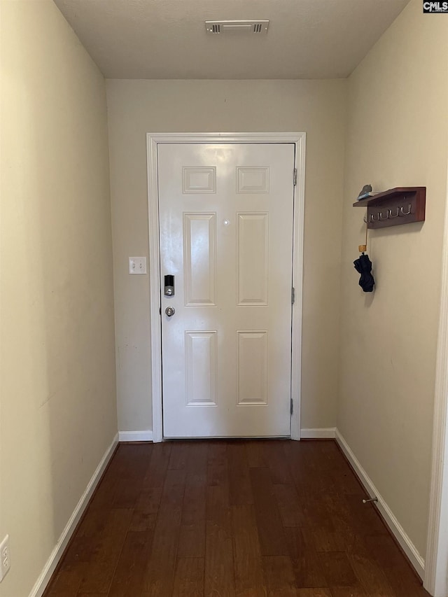 doorway to outside with dark hardwood / wood-style flooring