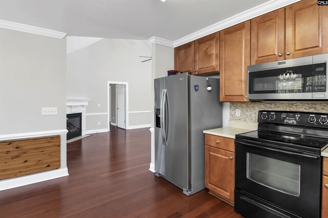 kitchen featuring backsplash, dark wood-type flooring, crown molding, ceiling fan, and stainless steel appliances