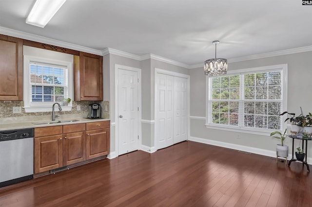 kitchen featuring decorative backsplash, stainless steel dishwasher, a healthy amount of sunlight, and sink