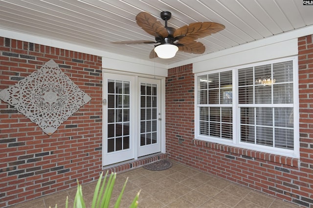 exterior space featuring ceiling fan