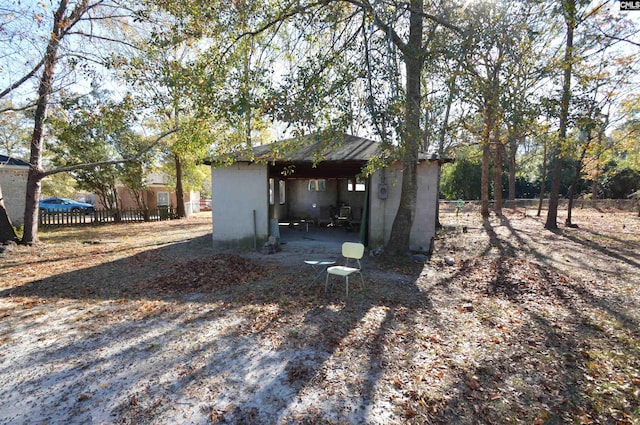 view of side of home featuring an outdoor structure