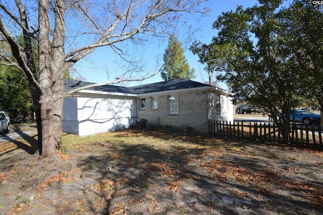 view of home's exterior with central AC unit