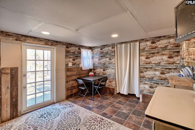 dining area with wooden walls