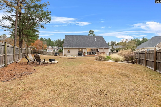 back of property featuring a lawn