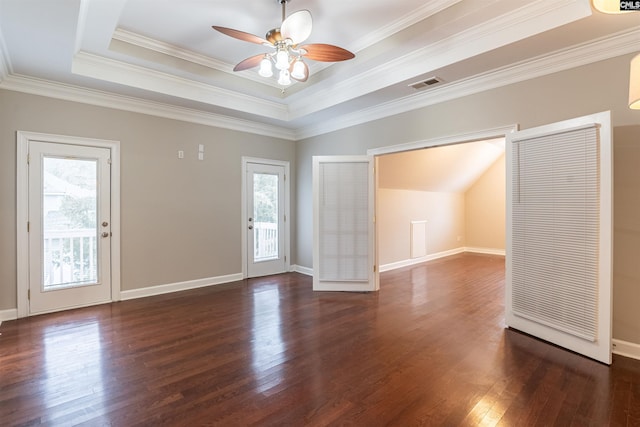 interior space featuring a raised ceiling, ceiling fan, dark hardwood / wood-style flooring, and crown molding