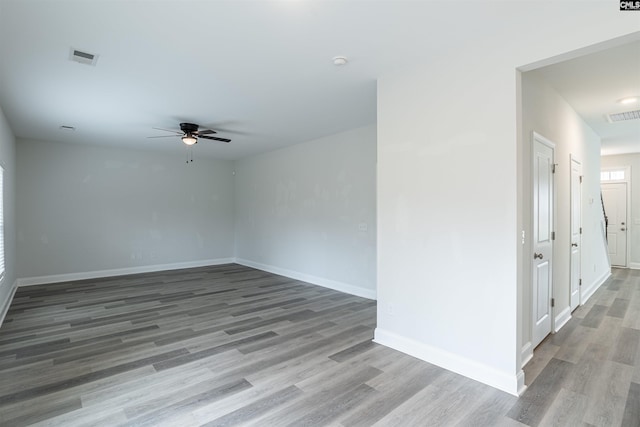 unfurnished room with hardwood / wood-style floors and ceiling fan