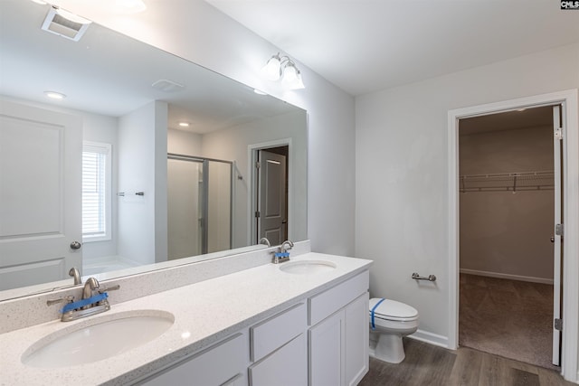 full bathroom featuring hardwood / wood-style floors, vanity, toilet, and independent shower and bath