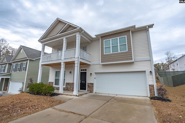 view of front of home featuring a garage and a balcony