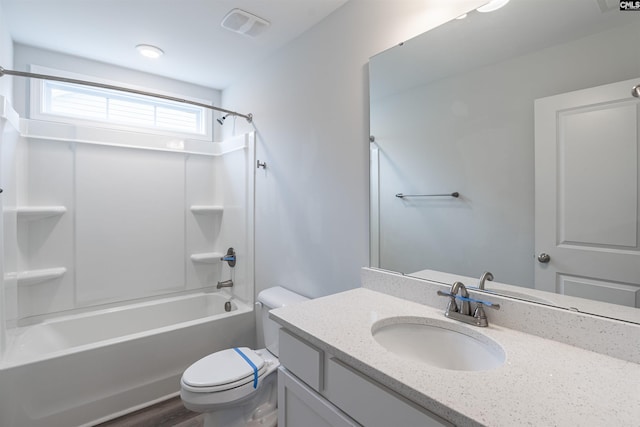 full bathroom with toilet, vanity,  shower combination, and hardwood / wood-style flooring