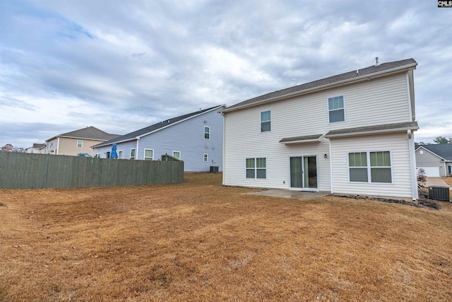 back of house featuring central AC