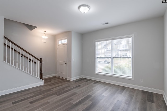 entryway with dark hardwood / wood-style floors