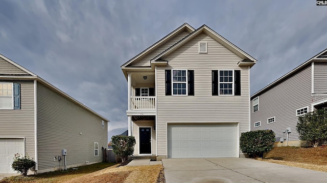 view of front of property with a garage and a balcony