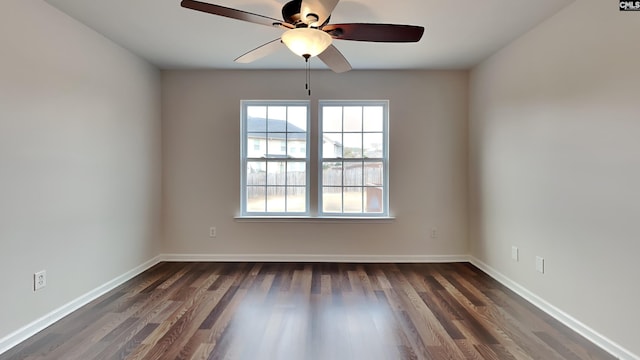 unfurnished room featuring dark hardwood / wood-style flooring and ceiling fan