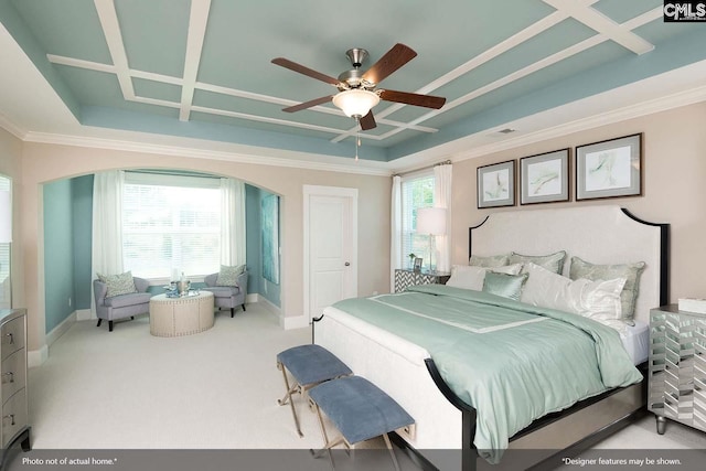 carpeted bedroom with coffered ceiling, ceiling fan, and multiple windows