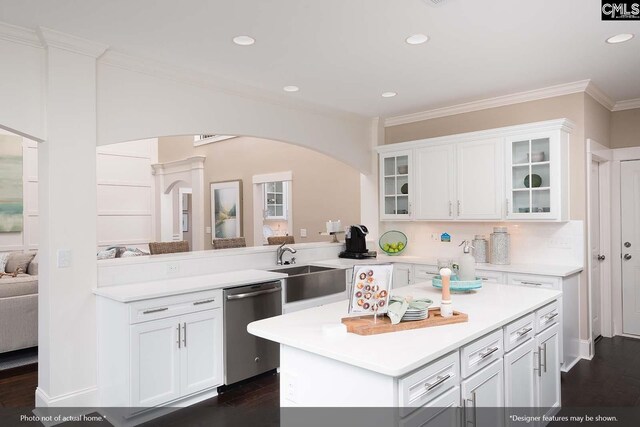 kitchen featuring kitchen peninsula, white cabinets, crown molding, dishwasher, and dark hardwood / wood-style floors