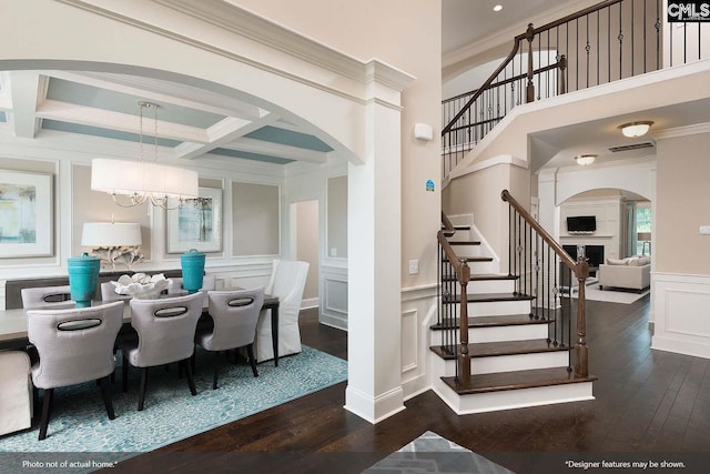 dining room featuring a chandelier, dark wood-type flooring, crown molding, and coffered ceiling