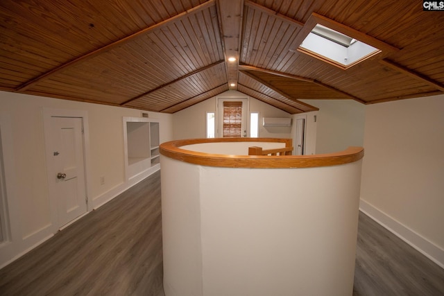 interior space with dark hardwood / wood-style floors, an AC wall unit, wooden ceiling, and vaulted ceiling with skylight