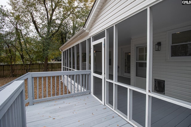 wooden terrace featuring a sunroom