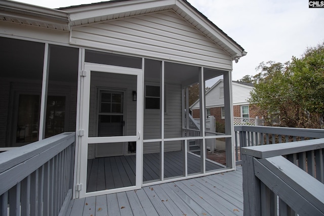 deck with a sunroom