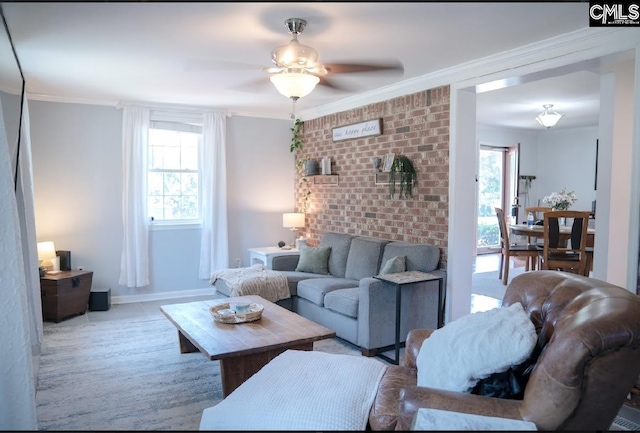 living room featuring ceiling fan and ornamental molding