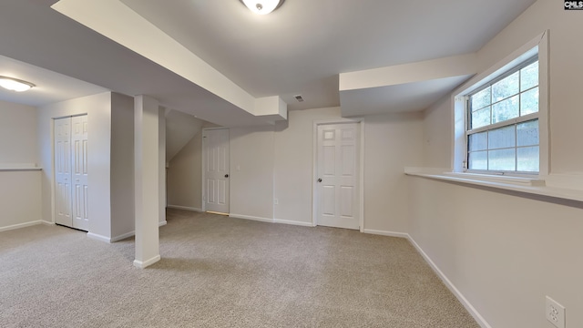 basement with light colored carpet