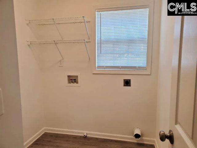 washroom featuring washer hookup, electric dryer hookup, hookup for a gas dryer, and dark wood-type flooring