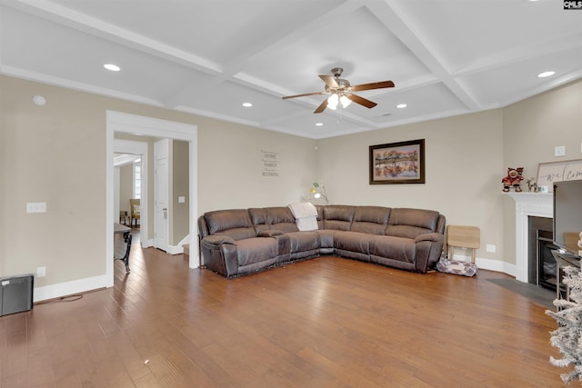 living room with hardwood / wood-style floors, beamed ceiling, and coffered ceiling