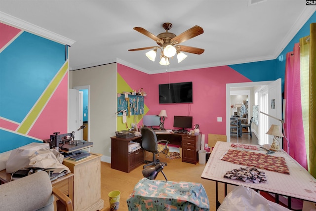 office area with ceiling fan, crown molding, and light carpet