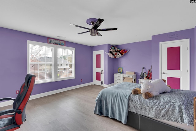 bedroom featuring hardwood / wood-style flooring and ceiling fan