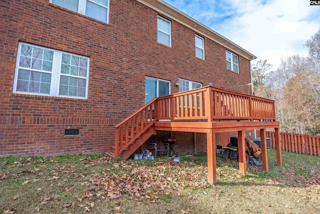 back of property with central AC and a deck