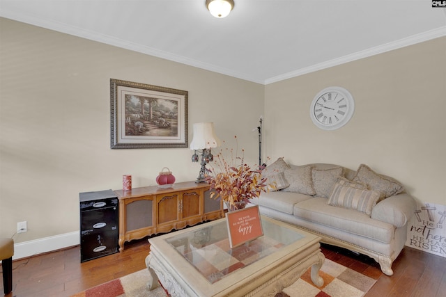 living room featuring wood-type flooring and crown molding