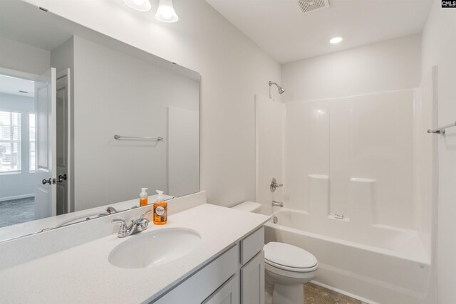 full bathroom featuring vanity, shower / bath combination, and toilet