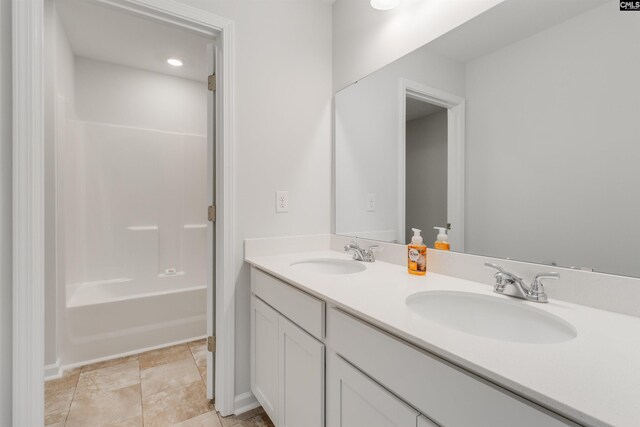 bathroom featuring vanity and shower / bath combination