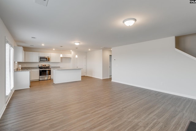 unfurnished living room featuring light wood-type flooring