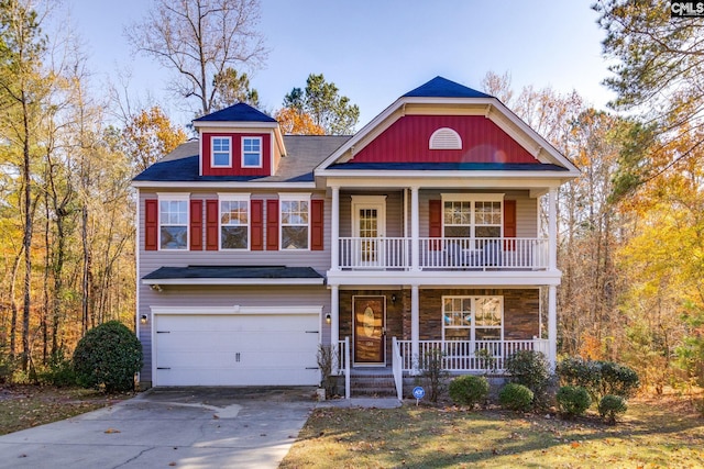 view of front facade featuring covered porch and a garage