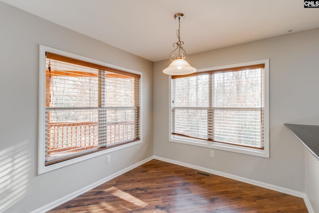 dining area featuring dark hardwood / wood-style floors