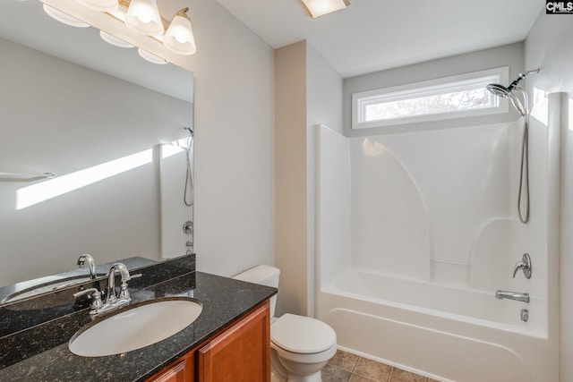 full bathroom with tile patterned flooring, vanity, washtub / shower combination, and toilet