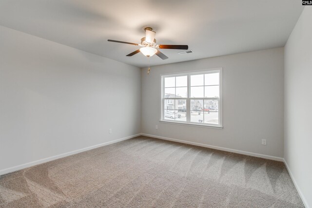 empty room with carpet and ceiling fan