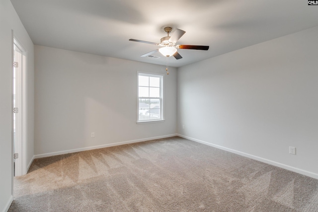 carpeted empty room with ceiling fan