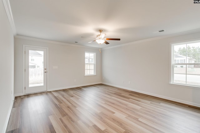 unfurnished room with ceiling fan, plenty of natural light, light hardwood / wood-style floors, and ornamental molding