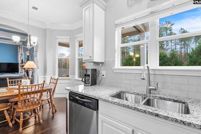 kitchen with dark hardwood / wood-style flooring, tasteful backsplash, stainless steel dishwasher, sink, and white cabinetry