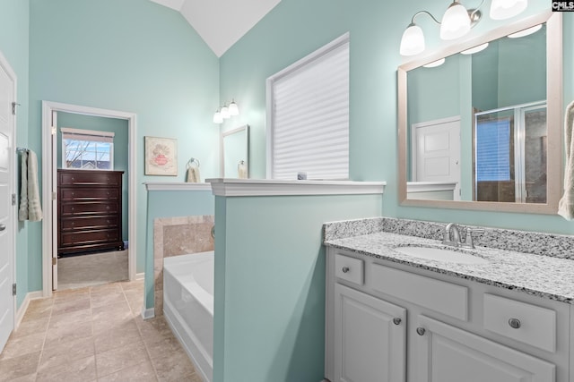 bathroom with tile patterned flooring, vanity, vaulted ceiling, and independent shower and bath