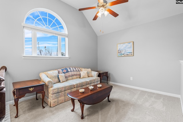 carpeted living room featuring ceiling fan and high vaulted ceiling