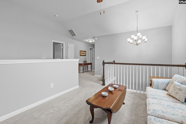 living room featuring ceiling fan with notable chandelier, light carpet, and high vaulted ceiling