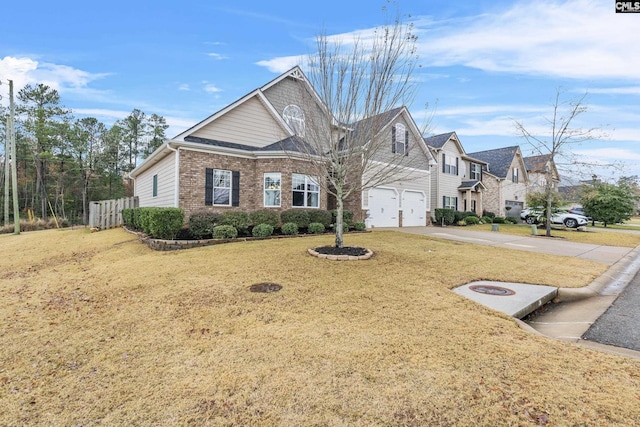 view of front of home featuring a garage and a front lawn